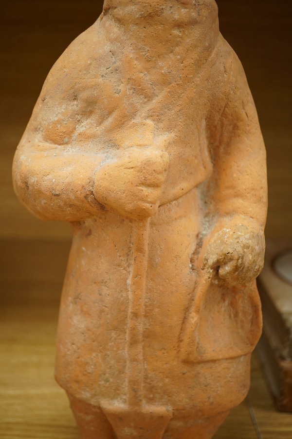 A Han Dynasty-style Chinese terracotta figure, 44cm high. Condition - fair